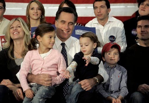 Mitt Romney, center, sits with his family from