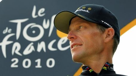 Lance Armstrong looks back on the podium after