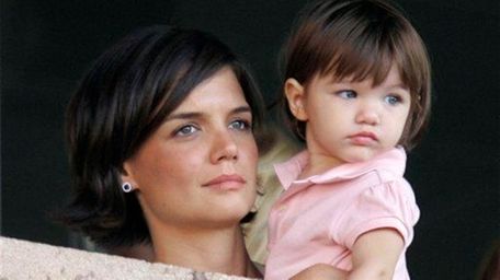 Katie Holmes and daughter Suri Cruise watch the