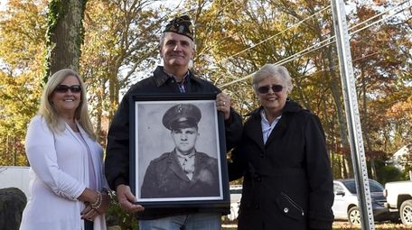 Great-niece Pam DeCostello, left, nephew Peter Bugala, and