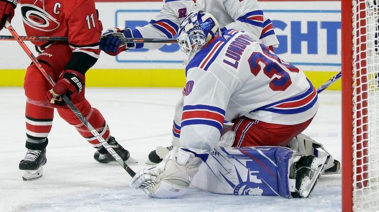 Rangers goaltender Henrik Lundqvist (30), of Sweden, blocks