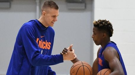 Kristaps Porzingis interacts with Knicks guard Frank Ntilikina