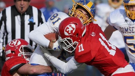 Comsewogue's Anthony Cambria gets taken down by East