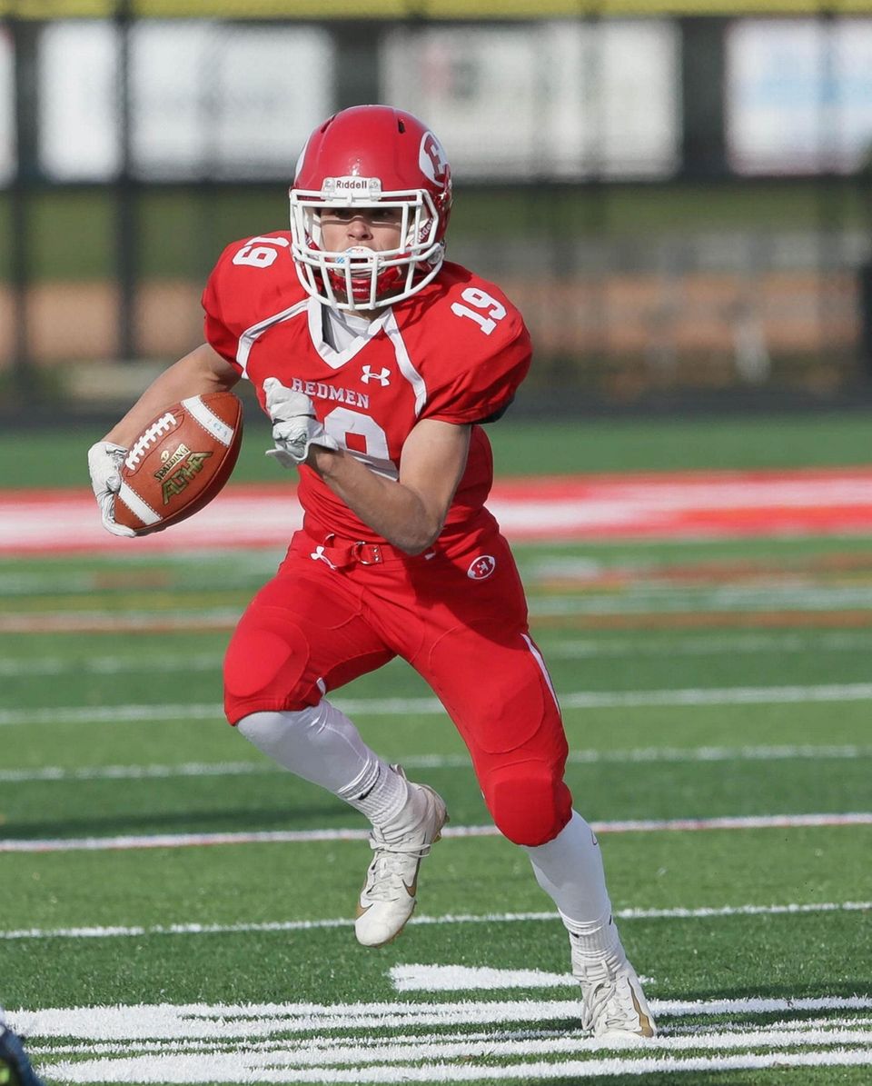 East Islip's Derek Burrell (19) runs the ball