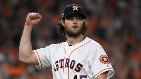 Houston Astros starting pitcher Gerrit Cole (45) reacts