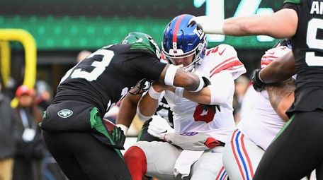 Jets safety Jamal Adams steals the ball from