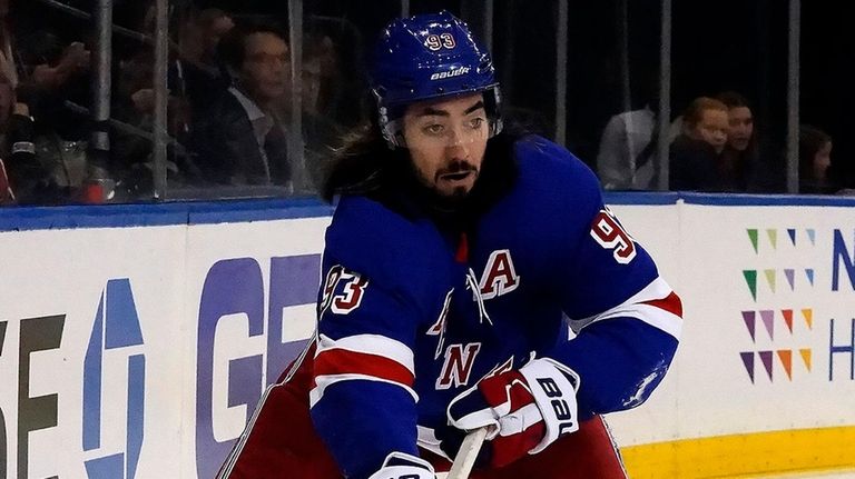 Rangers center Mika Zibanejad sets up a pass