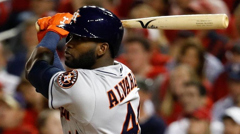 Houston Astros' Yordan Alvarez watches his two-run home