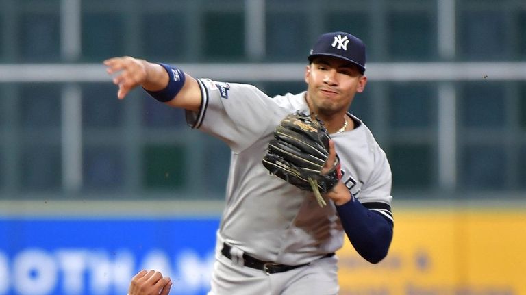 Yankees second baseman Gleyber Torres (25) throws to