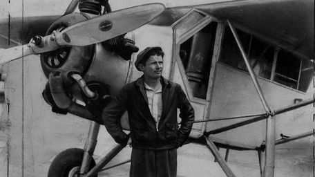 1938: Douglas (WrongWay) Corrigan stands next to plane