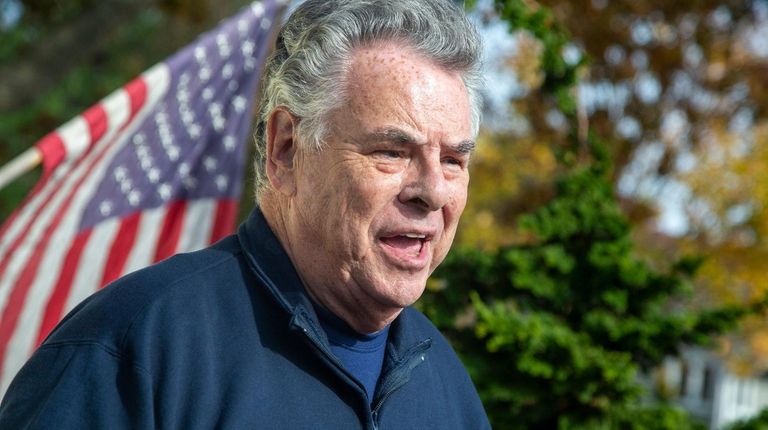 Congressman Peter King speak outside his home after
