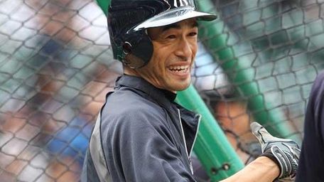Ichiro Suzuki of the New York Yankees warms