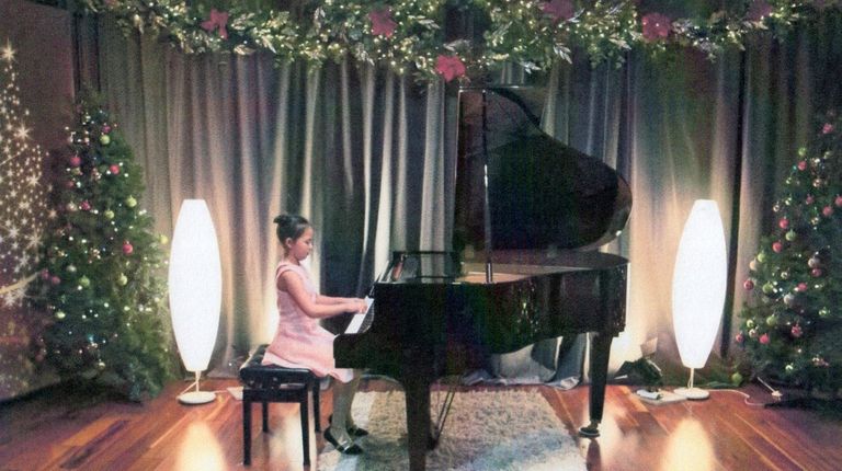 Kidsday reporter Olivia Lebron playing the piano.