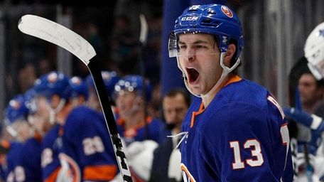 Mathew Barzal of the Islanders celebrates his first