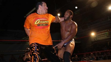 Tommy Dreamer, left, locks up with Jay Lethal