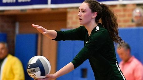 Emily DeVito of Seaford prepares to serve during