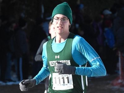 Gavin Ehlers of West Hampton Beach (1111) runs
