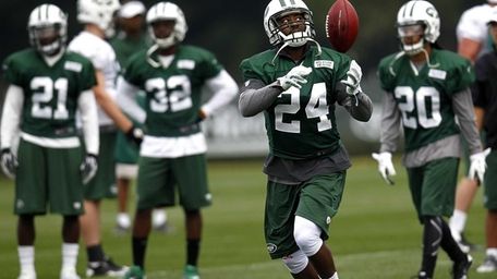 Darrelle Revis works out during the first day