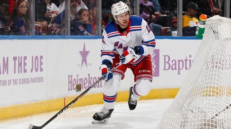 Artemi Panarin of the Rangers circles behind the
