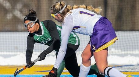 Carle Place defenseman Alexus Coward shoots the ball