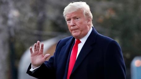 President Donald Trump waves as he departs on