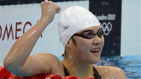 China's Ye Shiwen celebrates after winning the women's