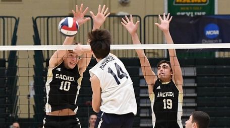 Sachem North middle blocker Christopher Lehnert (10) and