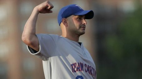 Craig Carton shows his muscle at shortstop as