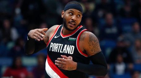 Trail Blazers forward Carmelo Anthony turns down court