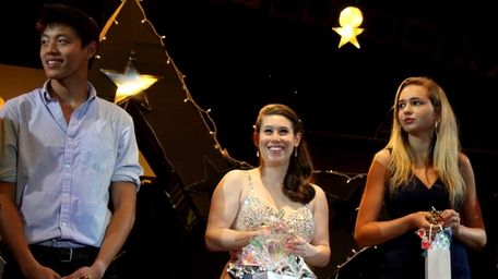 Sarah Shaiman, center, wins first place at the