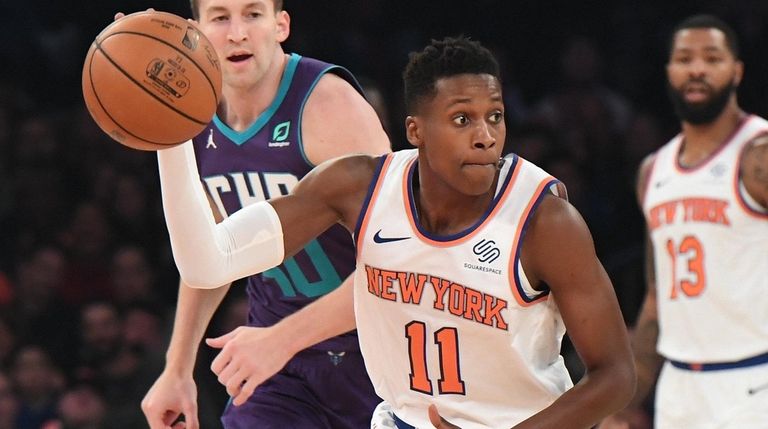 Knicks guard Frank Ntilikina looks to pass the