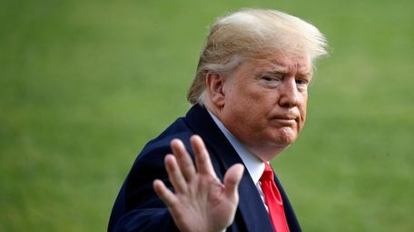 President Donald Trump walks to Marine One after