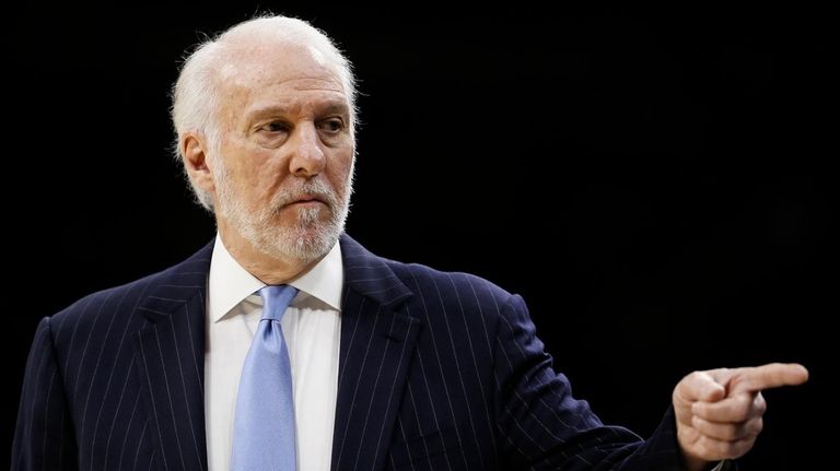 San Antonio Spurs coach Gregg Popovich points to