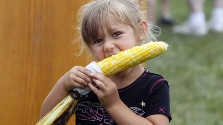 Savanna Barnetas, 3, of Centereach works on an