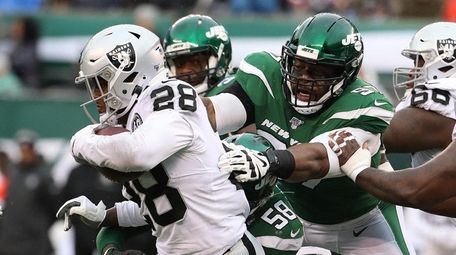Josh Jacobs of the Raiders runs against the