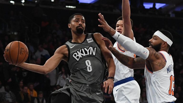 Nets guard Spencer Dinwiddie passes the ball from
