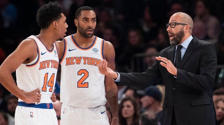 Knicks coach David Fizdale, right, talks to guard