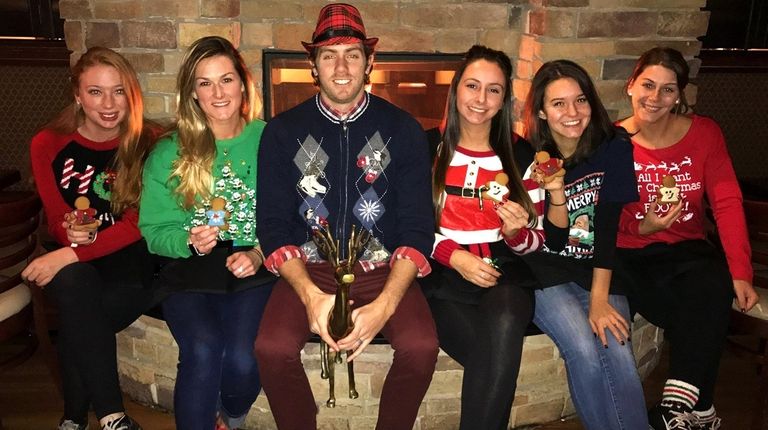 Guests sit by the fire in their ugly