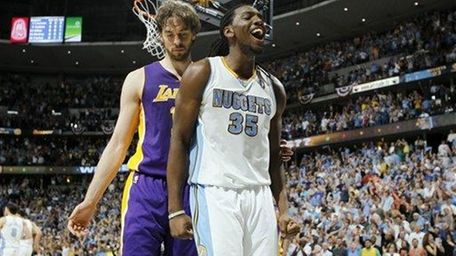 Denver Nuggets rookie forward Kenneth Faried, right, reats