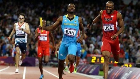 Bahamas' Ramon Miller beats United States' Angelo Taylor