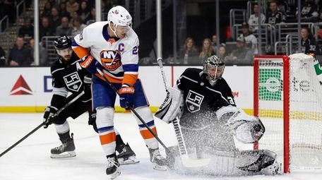 Los Angeles Kings goaltender Jonathan Quick, right, stops