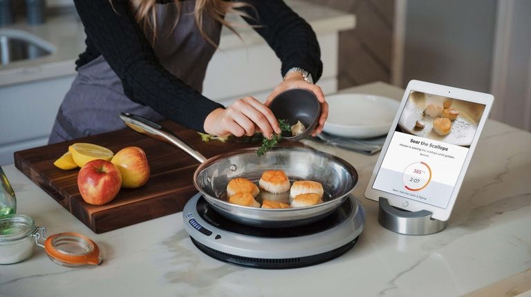 The Hestan Cue Smart Cooking System includes an