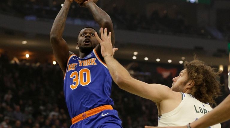 The Knicks' Julius Randle shoots against the