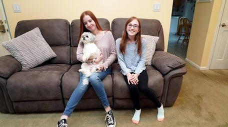 Danielle Merting, 21, left, and Sadie Merting, 12,