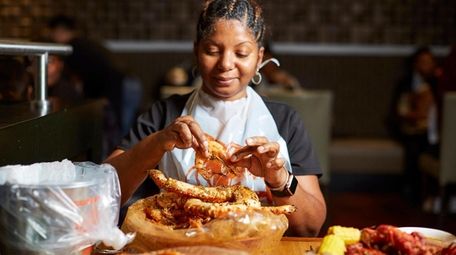 Nadine Cole from Baldwin enjoys the king crab
