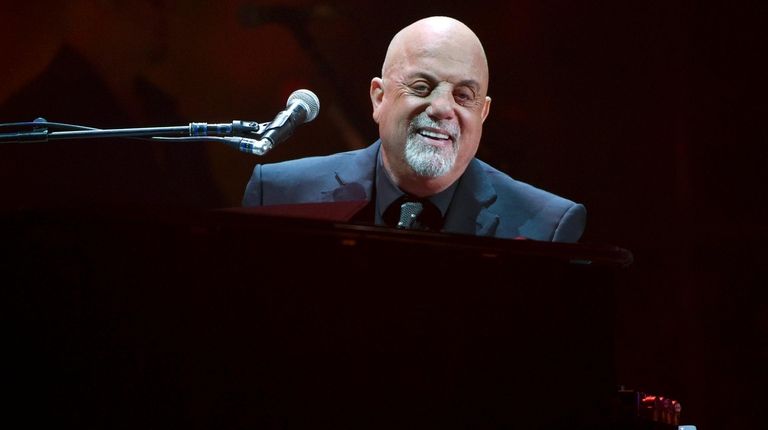 Billy Joel performs during his 100th Madison Square