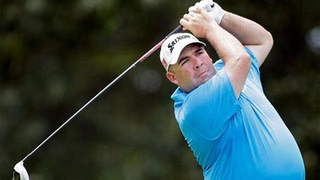 Kevin Stadler watches his tee shot on the