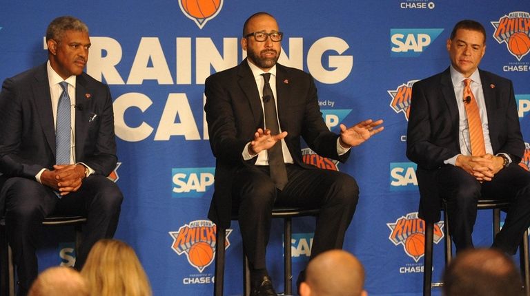 David Fizdale, center, speaks with the media during