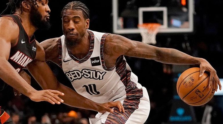 Nets guard Iman Shumpert drives against Miami Heat