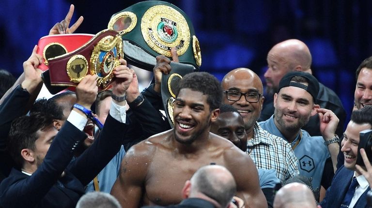 British boxer Anthony Joshua celebrates after winning the